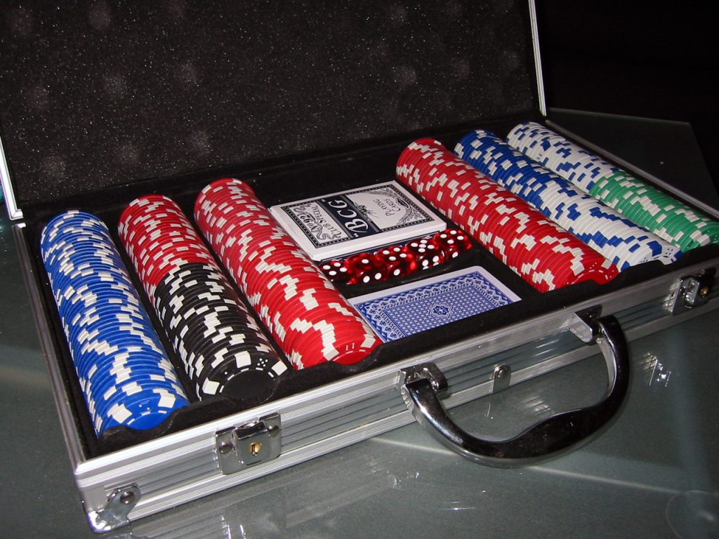 taking a rake in poker suitcase with poker set